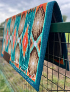 Em Custom Ranch Pads Desert Glow, dark ocean blue, teal, bright mint, white, chocolate, tan, orange & tangerine tones, western ranch pad in stock lifestyle